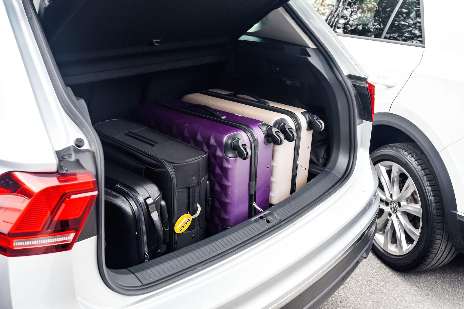 Photo by Swansway Motor Group a car with a suitcase in the trunk